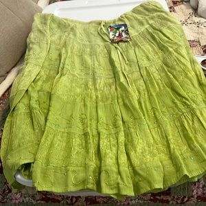 Beautiful Lime green 100 % Rayon skirt. New with tags. Ties at waist. Flows